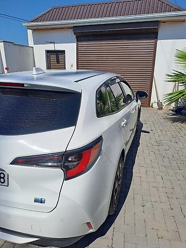 elit ehtiyat hisseleri: Toyota Corolla Touring Sports Hybrid – universal kuzovlu, ağ rəng — 1