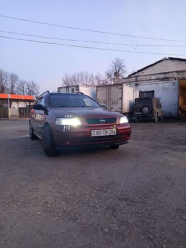 tap az opel vectra: Opel Astra универсал kuzovlu minik avtomobil. Rəngi tünd qırmızı — 2