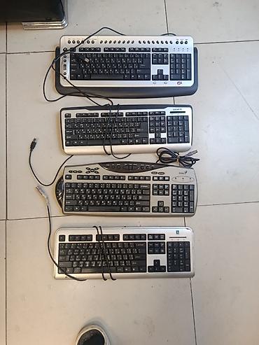 Masaüstü kompüter üçün 4 ədəd klaviatura dəsti. Şəkildə müxtəlif marka