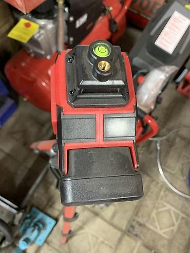 royce laser level: Лазерный нивелир на штативе. - Проецирует лазерные линии для разметки — 2