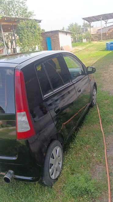 Daihatsu Cuore: 2005 г., 1 л, Механика, Бензин, Седан
