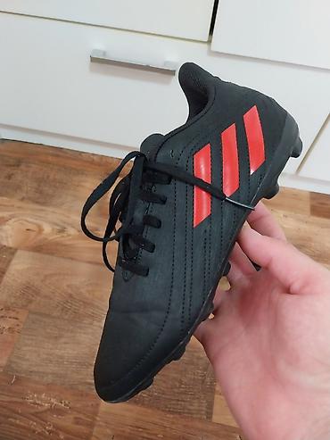 Kopačke: Fudbalske kopačke Adidas – crne sa crvenim prugama - Model sa — 2