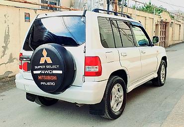 pajero tekeri: Mitsubishi Pajero iO 4WD – ağ rəngli, kompakt off-road SUV Maşına — 6