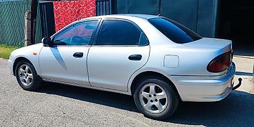 мата секыл: Mazda 323: 1997 г., 1.5 л, Кол менен иштөөчү, Бензин, Седан — 2