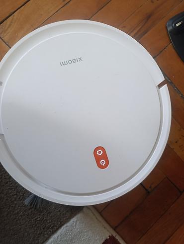 park sensor: Xiaomi robot tozsoran - Dairəvi, ağ korpus, üst paneldə iki düymə — 5