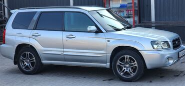 фары на опель вектра а: Серебристый кроссовер Subaru Forester с пятью дверями и рейлингами на