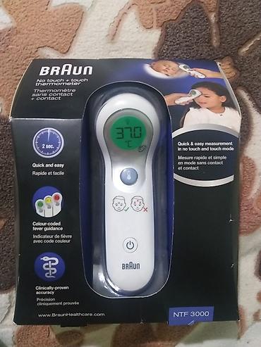 elektron termometr: Braun NTF3000 – təmassız və toxunaraq ölçən alın termometri — 1