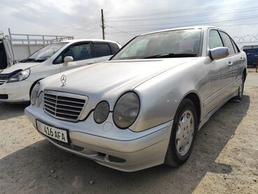 мерс 817 гигант: Автомобиль Mercedes-Benz E-класса в кузове W210, серебристого цвета