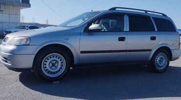 opel surətlər qutusu: Opel Astra Caravan (steyşn-vaqon), gümüşü rəng. - Kuzov: uzun dam