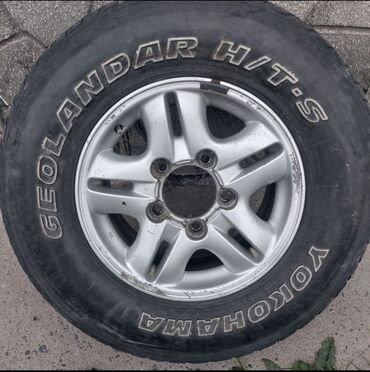 диски 470: Срочно продаю запаску на LX 470 Размер 265/70 R16