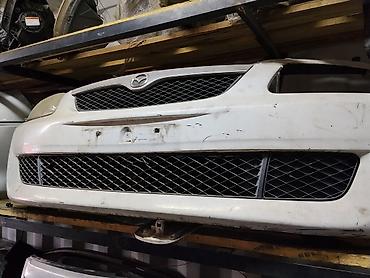 Передний бампер Mazda (эмблема Mazda). Цвет: белый. Комплектация: - at lalafo.kg Передний бампер Mazda (эмблема Mazda). Цвет: белый. Комплектация: -
