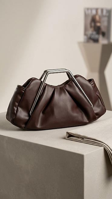 Möhkəm metal tutacaqlı, tünd qəhvəyi rəngdə moda çanta. - Material lalafo.az -da Möhkəm metal tutacaqlı, tünd qəhvəyi rəngdə moda çanta. - Material