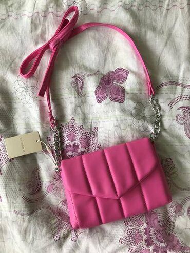 denim farmerke cena: Primark pink torba sa etiketom. snizena cena. Manjih dimenzija