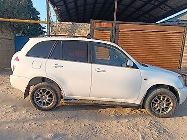 kia cerato 2012: Chery Tiggo (T11) krossover, ağ rəng. Texniki xüsusiyyətlər və — 3