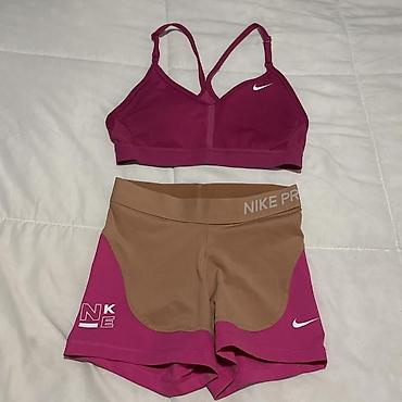 uomo torbe: Nike ženski set za trening – sportski grudnjak + šorts - Brend: Nike — 1