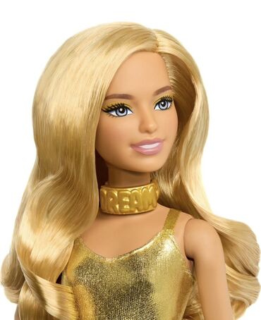 uşaq velür insancıqlar: Barbie kolleksiyasından qızılı rəngli geyimdə olan bu kukla, uzun sarı