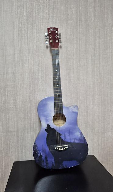 Гитары: Akustik gitara – “Ağlayan canavar” dizaynı - Korpus: kəsik (cutaway) — 1