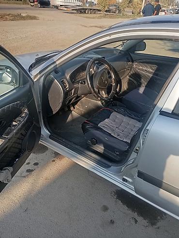 Унаа сатуу: Mitsubishi Carisma: 2001 г., 0.6 л, Кол менен иштөөчү, Газ, Седан — 5