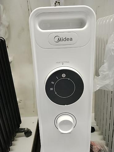 midea: Масляный обогреватель Кол-во секций: 10 и более, Несколько режимов мощности — 2