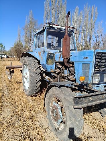 Унаа: Трактор колесный с кабиной, с навесным плугом Описание: - Колесный — 2