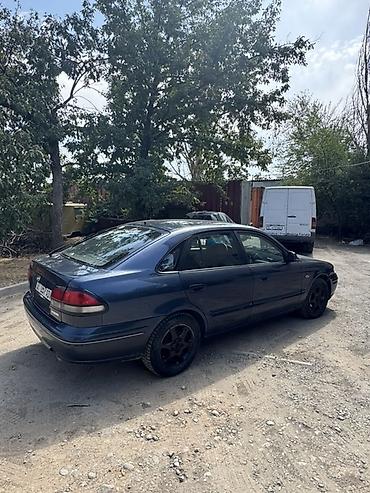 зеркела: Mazda 626: 1997 г., 1.8 л, Кол менен иштөөчү, Седан — 3