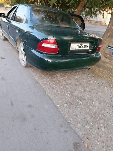 daewoo lanos 1: Седан тёмно‑зелёного цвета, 4 двери. Кузов классической формы конца — 2