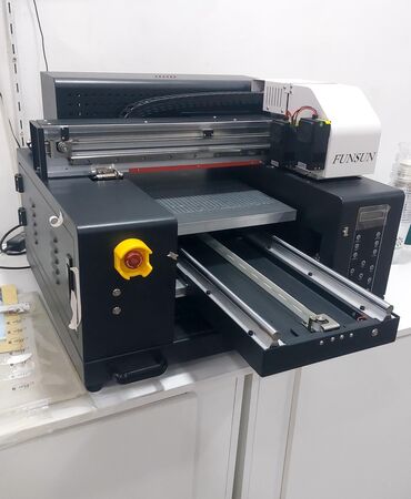 Paketləmə aparatları: Ultra fiolet printer A3 format istenilen berk .material uzerine 3D cap