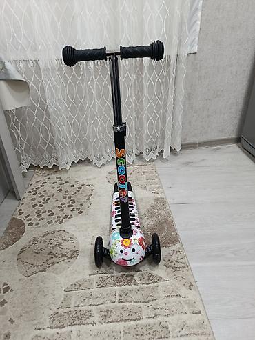 mapet satilir: Uşaq skuteri – 3 təkərli, çiçək naxışlı model,hec istifade edilmeyib — 5