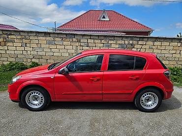Opel: Opel Astra H hatchback – parlaq qırmızı rəngdə, 5 qapı. Texniki — 1