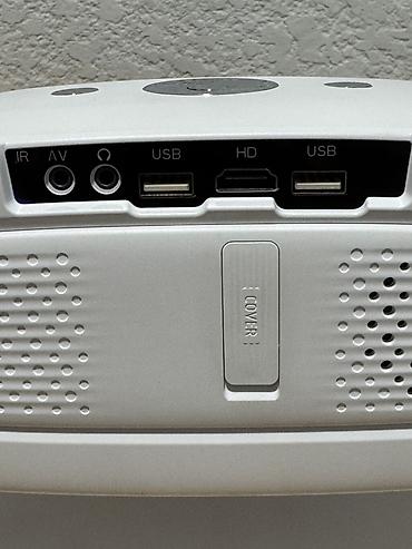 mini pc: Компактный портативный проектор с поворотной подставкой и защитным — 5