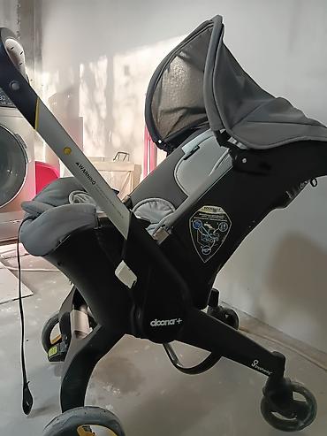 Автокресла: Doona+ (Doona Plus) — автокресло 0+ и прогулочная коляска 2‑в‑1 — 1