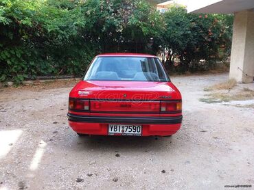 Mazda 323: 1.6 l | 1990 year Sedan