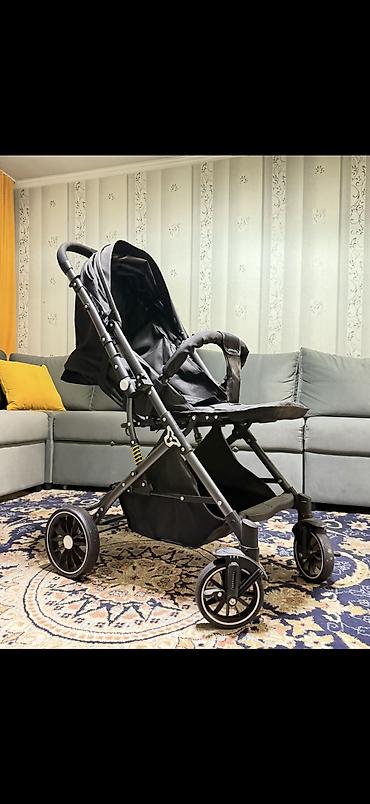 Коляски: Коляска (черная), складная Особенности: - Легкая алюминиевая рама — 1