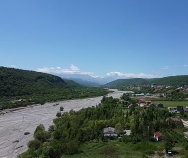 Kommersiya daşınmaz əmlakının satışı: Qusar şəhərində(200 sot) Şahdağa gedən yolun Qusar çayının sol — 2