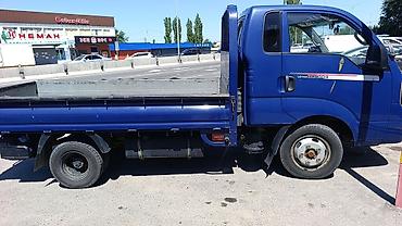 kiya bongo: Kia Bongo III — компактный бортовой грузовик синего цвета. Кузов и — 2