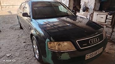 bmw f10 lip: Audi A6 sedan təqdim olunur. Avtomobil tünd rəngdədir, 4 qapılı кузов — 1