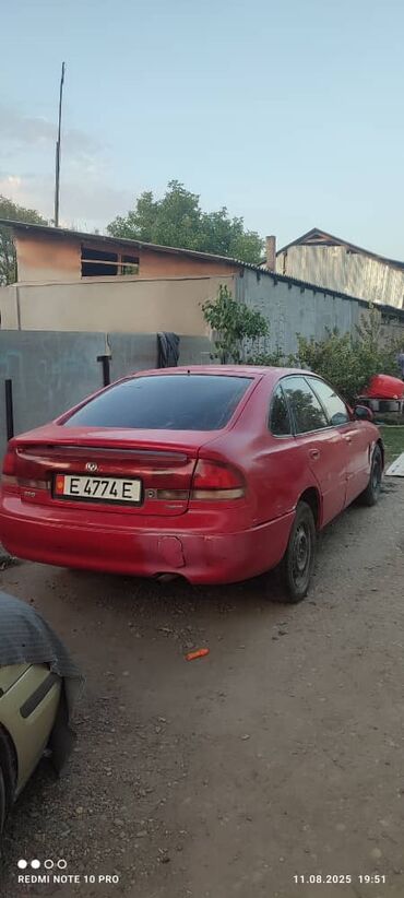 не рабочий на запчасти: Продается красный седан Mazda 626. Автомобиль оснащен механической