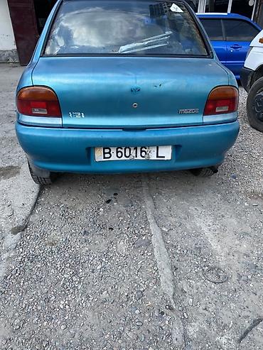 фара мазда 121: Mazda 121: 1991 г., Седан — 4