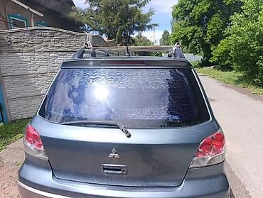 Унаа: Mitsubishi Outlander: 2003 г., 0.2 - engine capacity л, Кол менен иштөөчү, Газ, Кроссовер — 3