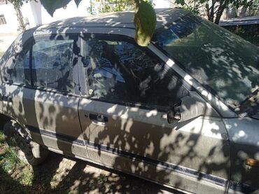 домкрат 124: Mazda 323: 1992 г., Седан