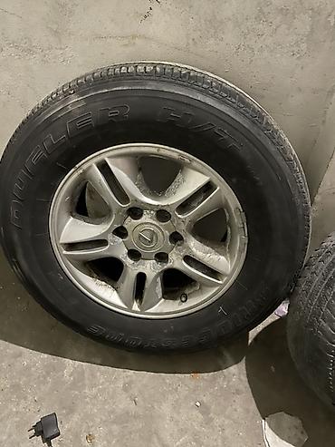 Шины и диски: Колесо в сборе для внедорожника/SUV. Состав: - Шина Bridgestone — 1