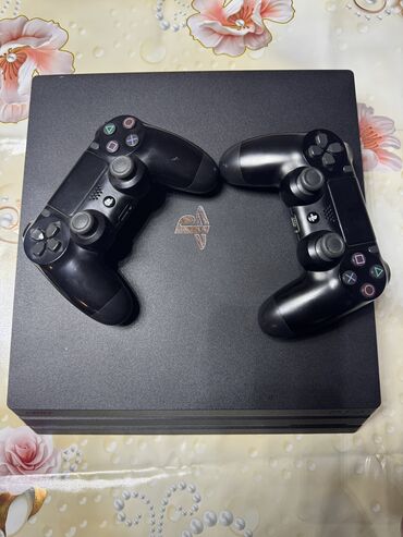 playstation 4 pro 1tb qiymeti: Ps 4 pro 1tb evdə isdifadə olunub pultları tam orijinaldır üsdündə
