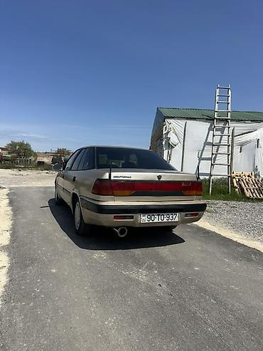 Opel: Model: daevoo Espero Rəng: qızılı/şampan Kuzov: 4 qapı, geniş salon — 7