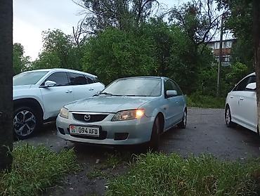 mers e210: Mazda 323: 2002 г., Механика, Хэтчбэк — 3