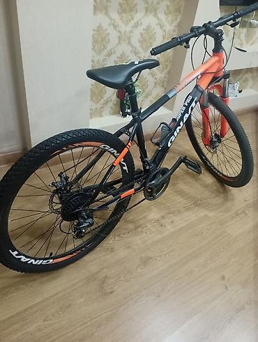 Velosipedlər: Məhsul: Dağ velosipedi (GINAT/GIANT üslublu, narıncı-qara rəng sxemi) — 2