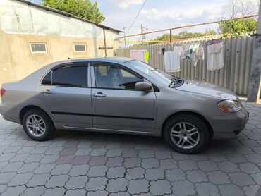 купить машину за 2000 долларов: Седан Toyota Corolla в бежевом цвете, 1.8 бензин, автомат левый руль
