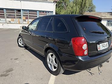 Транспорт: Mazda 323: 2002 г., 1.6 л, Механика, Бензин, Хэтчбэк — 3