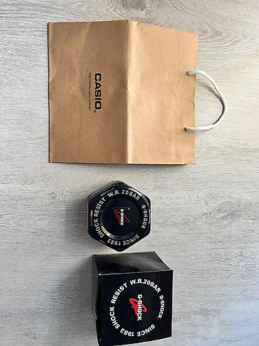 romanson satovi cena: Casio G-Shock ručni sat u beloj boji, sa prepoznatljivim robusnim — 3