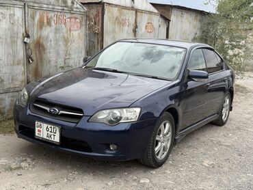 коробка легаси: Седан Subaru Legacy тёмно-синего цвета с четырьмя дверями и