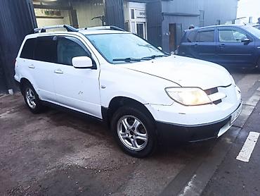 где принимают аккумуляторы: Mitsubishi Outlander: 2003 г., 2.4 л, Автомат, Газ, Кроссовер — 5